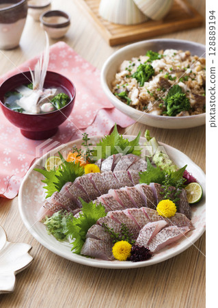 Sea bream sashimi / Sea bream cooked in pine bark Sea bream sashimi / Sea bream cooked in pine bark 128889194