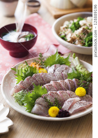 Sea bream sashimi / Sea bream cooked in pine bark Sea bream sashimi / Sea bream cooked in pine bark 128889196