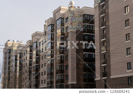 High-rise residential buildings against the blue sky in the city. 128889241