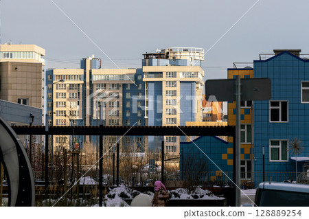High-rise residential buildings against the blue sky in the city. 128889254