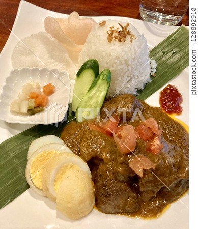 Rendang, a traditional dish in an Indonesian restaurant Rendang, a traditional dish in an Indonesian restaurant 128892918