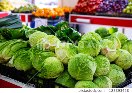 Green leafy vegetables on market counter Green leafy vegetables on market counter 128893438
