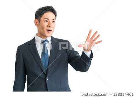 A middle-aged Asian businessman in a suit spreading his palm (reject, surprise, caution, surprise, no, stop) A middle-aged Asian businessman in a suit spreading his palm (reject, surprise, caution, surprise, no, stop) 128894461