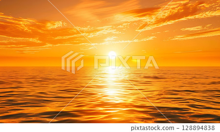 Golden sunset over a vast ocean casting a warm glow 128894838