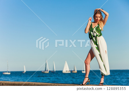 Fashion woman against sea. Fashion woman against sea. 128895355