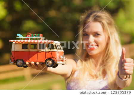 Woman holding hippie van object model Woman holding hippie van object model 128895379