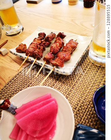 Kyoto purple radish pickles and yakitori at an izakaya 128895515