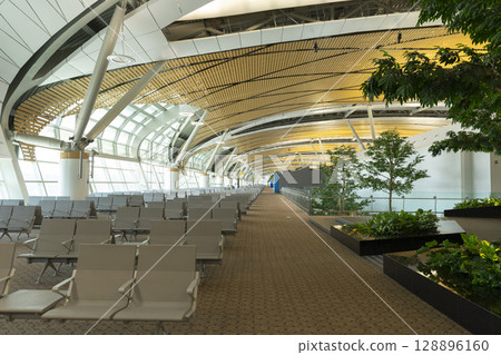 Bangkok, Thailand - April 9,2024 : Interior view of the new SAT-1 terminal in Suvarnabhumi Airport in Bangkok, Thailand on April 9,2024. Bangkok, Thailand - April 9,2024 : Interior view of the new SAT-1 terminal in Suvarnabhumi Airport in Bangkok, Thailand on April 9,2024. 128896160