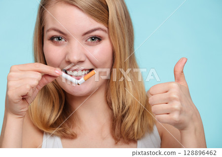 Girl break down cigarette. 128896462