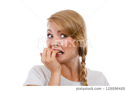 Scared, stressed woman biting her nails 128896488