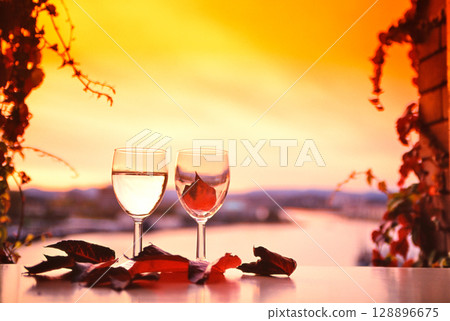 A pair of glasses by the window in autumn colors 128896675