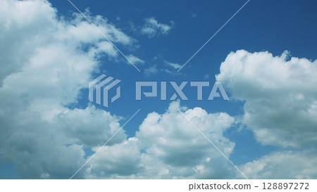 The Changing Dynamic Cloud Patterns Set Against a Clear Blue Sky Create a Stunning Scene The Changing Dynamic Cloud Patterns Set Against a Clear Blue Sky Create a Stunning Scene 128897272