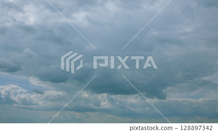 Dramatic and Beautiful Cloudy Sky Filled With Varied and Intriguing Cloud Textures Dramatic and Beautiful Cloudy Sky Filled With Varied and Intriguing Cloud Textures 128897342