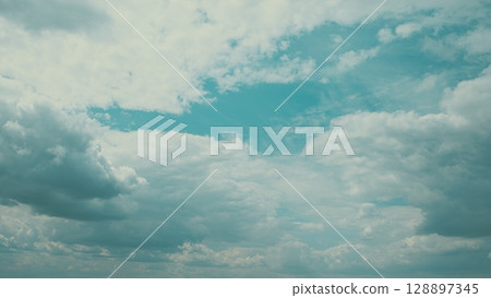 A Serene and Beautiful Cloudy Sky with Various Shades of Blue, Evoking Calmness and Peace A Serene and Beautiful Cloudy Sky with Various Shades of Blue, Evoking Calmness and Peace 128897345