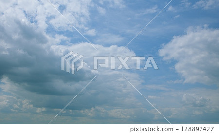 A Dynamic Cloudy Sky Filled with Open Expanses of Blue in Various Atmospheric Conditions 128897427