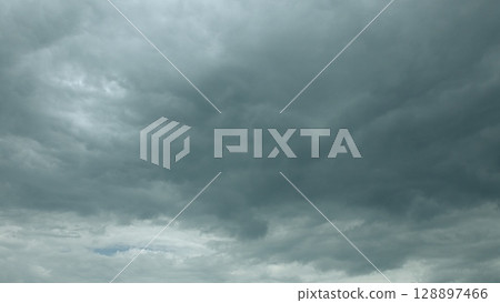 Dramatic Cloudy Sky There is a Dark Cloud Cover Overhead, creating an intense atmosphere Dramatic Cloudy Sky There is a Dark Cloud Cover Overhead, creating an intense atmosphere 128897466