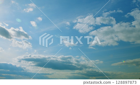 A Beautiful Sky Filled with Fluffy and White Clouds on a Bright and Sunny Day Today A Beautiful Sky Filled with Fluffy and White Clouds on a Bright and Sunny Day Today 128897873