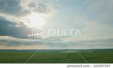 A Serene Landscape Captured with a Dramatic Sky and Beautiful Sunlight pouring in A Serene Landscape Captured with a Dramatic Sky and Beautiful Sunlight pouring in 128897897