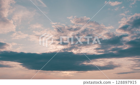 The beautiful cloudy sky at dusk, a breathtaking scene filled with colors and tranquility 128897915