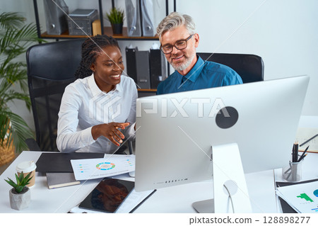 Professional Team Collaborating on a Project at Modern Office Workspace 128898277