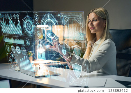 Professional Woman Interacting With Futuristic Technology Interface For Data Analysis 128898412