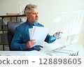 Professional Business Analyst Using Futuristic Technology In Modern Office 128898605
