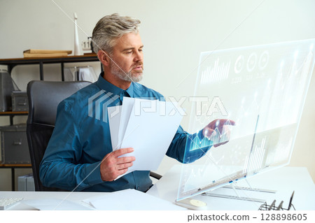Professional Business Analyst Using Futuristic Technology In Modern Office 128898605