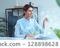Businesswoman Interacting With Virtual Interface Displaying Data And Technology Concepts 128898628