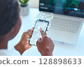 Modern Technology Illustration Featuring Holographic Smartphone Display and Laptop Interaction 128898633