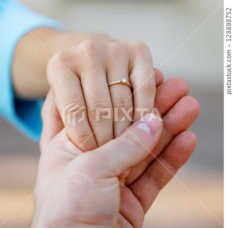 Hands of a freshly married couple Hands of a freshly married couple 128898752