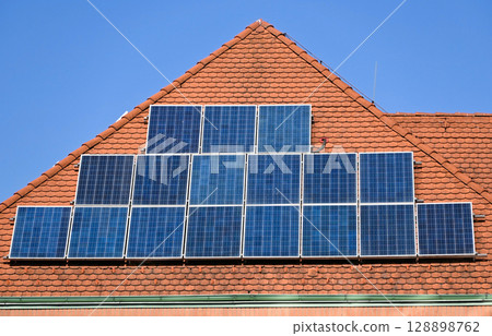 Solar panels on the roof of a building 128898762