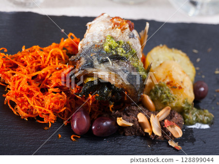 Scomber fish roll with bacon 128899044