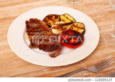 Appetizing beef entrecote with baked vegetables Appetizing beef entrecote with baked vegetables 128899125