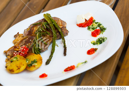 Photography of plate with baked veal with vegetables 128899303