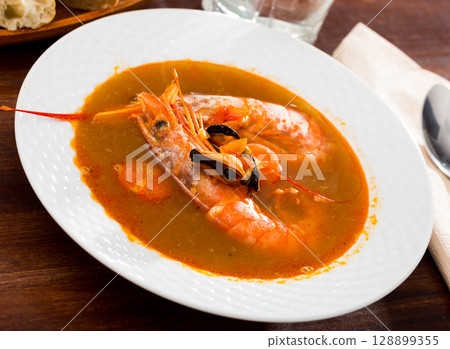 Spicy seafood soup with king prawns Spicy seafood soup with king prawns 128899355