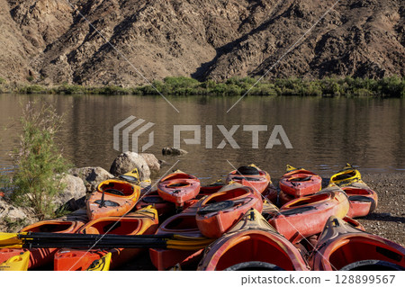 Colorful Kayaks Rest on the Shore Willow Beach in the Black Canyon of the Colorado River 128899567
