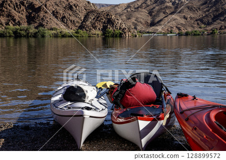 Kayaks Lined up at Copy Space on a Sunny Day in Arizona Kayaks Lined up at Copy Space on a Sunny Day in Arizona 128899572