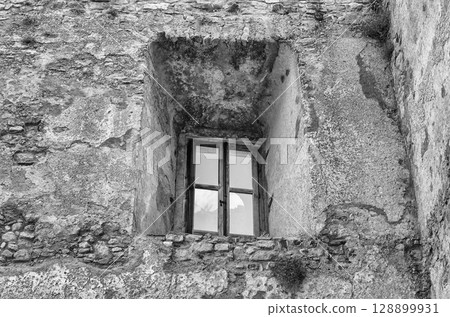 Ancient window from the ruins of an old castle 128899931