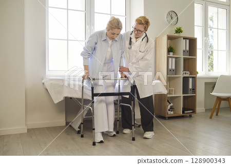 Doctor Helping Patient with Walker in Clinic 128900343