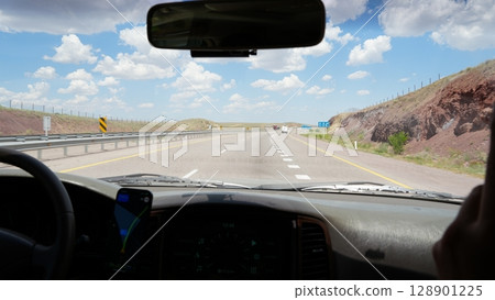 Driving along empty highway through american desert landscape 128901225