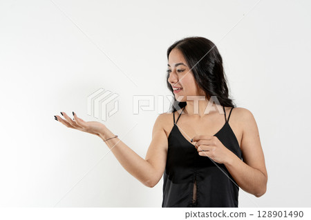 Young latin woman showing and presenting with open hand palm up 128901490