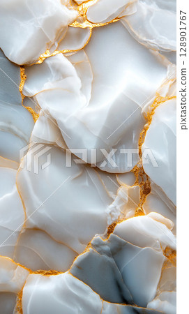Elegant white marble with golden veins and smooth texture 128901767