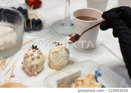 Decorated White Chocolate Strawberries with Hot Drink 128903056