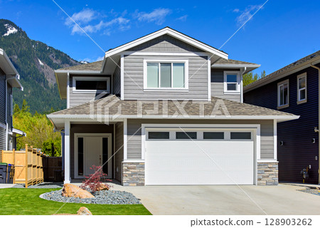 Brand new house on the final stage of construction Brand new house on the final stage of construction 128903262