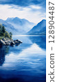 Serene lake landscape with mountains and reflections in water 128904487