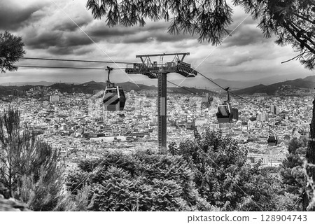 Montjuic Cable Cars and cityscape on background, Barcelona, Catalonia, Spain Montjuic Cable Cars and cityscape on background, Barcelona, Catalonia, Spain 128904743