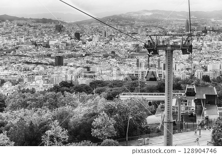 Montjuic Cable Cars and cityscape on background, Barcelona, Catalonia, Spain 128904746