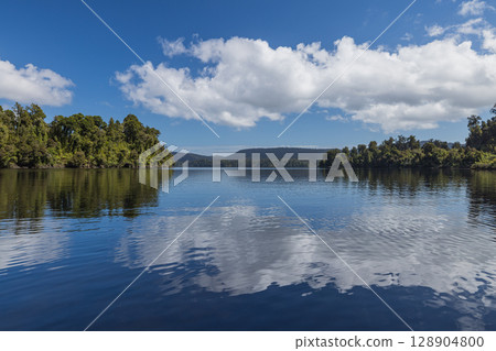 Lakeside view of Lake Maprika near Franz Josef on the West Coast of New Zealand 128904800