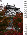 Castle tower surrounded by autumn leaves 128904858