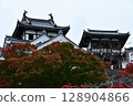 Castle tower surrounded by autumn leaves 128904866